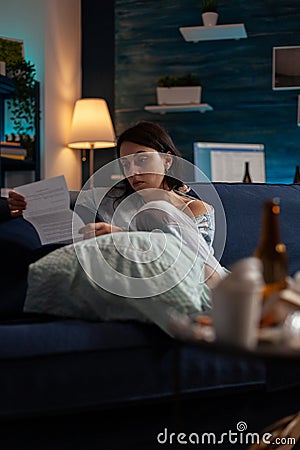 Depressed worried person reading eviction notice paper Stock Photo