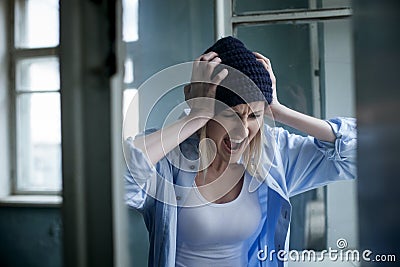 Depressed young female druggie is expressing Stock Photo