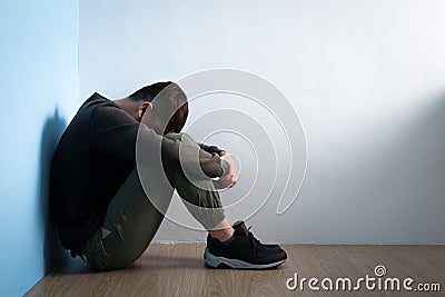 Depression man sit on floor Stock Photo