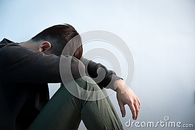 Depression man sit on floor Stock Photo