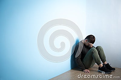 Depression man sit on floor Stock Photo