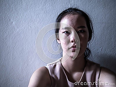Depression young female teenager having abused problem feeling suffering sitting alone, Domestic violence, family problems, Stress Stock Photo