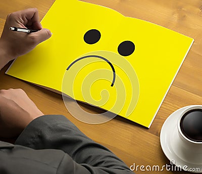 Depressive emotions concept, smiley face emoticon printed depr Stock Photo