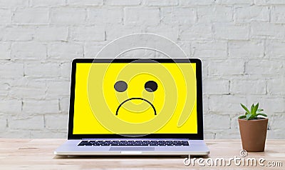 Depressive emotions concept, smiley face emoticon printed depr Stock Photo