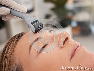 Derma rolling encourages collagen and elastin production. Closeup shot of a mature woman enjoying a micro-needling Stock Photo