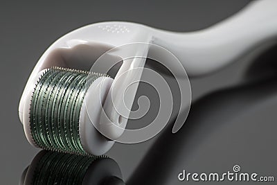 Dermaroller for medical micro needling therapy. Stock Photo