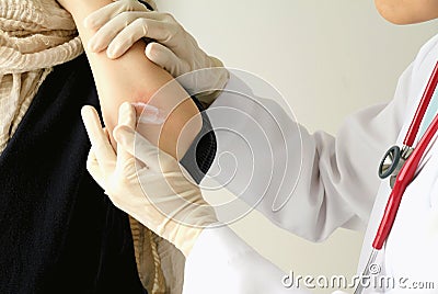 Dermatologist doctor doing treatment, Female patient with allergic rash dermatitis eczema skin. Stock Photo