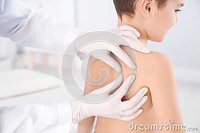 Dermatologist examining little boy`s birthmark Stock Photo