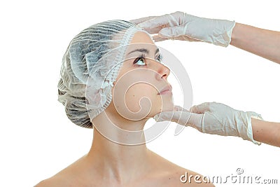 Dermatologist in gloves for a girl`s face prepares analyses close-up Stock Photo