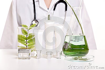 Dermatologist with natural skin care, Green herbal organic beauty product discovery at science lab Stock Photo