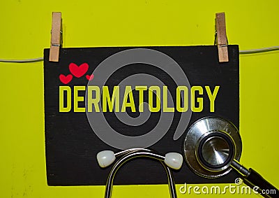 DERMATOLOGY on top of yellow background Stock Photo