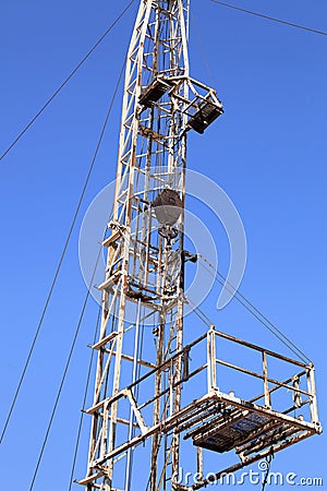 Derrick of Small Workover Rig on Sunny Day Stock Photo