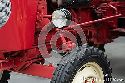 A detailed close up of an old messy red vintage tractor engine. Diesel engine air cooling soiled in oil and diesel fuel. Parts of Stock Photo