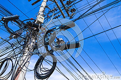 Electric pylon with caotic electric wiring Stock Photo