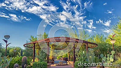 Desert Botanical Garden Phoenix Az, Gazebo with bright blue skies, beautiful clouds, and cactus species galore. Stock Photo