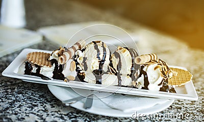 Desert ice-cream with waffels and tubules with chololate on top in cafe Stock Photo
