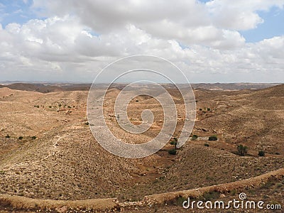 Mountainous part of the Sahara desert surrounding the city of Matmata, Tunisia Stock Photo
