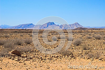 Desert landscapes with mountains in the south of Namibia. The dry season, dry vegetation Stock Photo