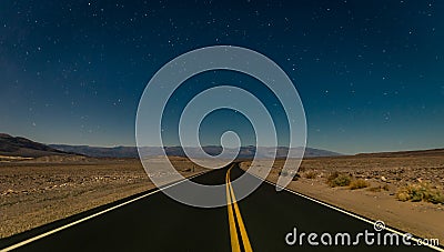 Desert road in the Death Valley by night Stock Photo