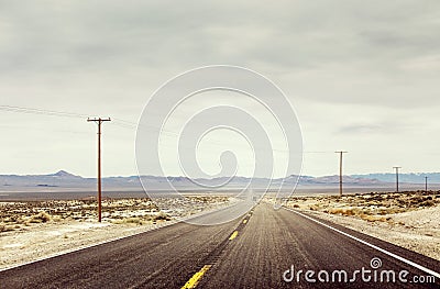 Desert Road With Telephone Poles Stock Photo