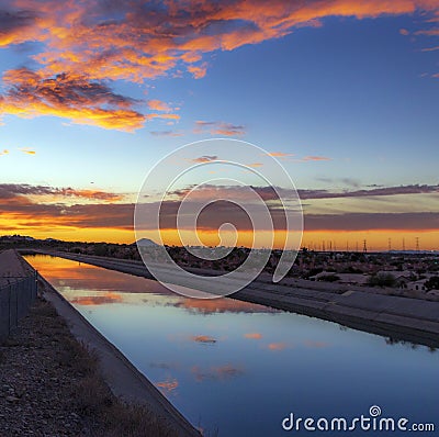 Colorful Desert Sunrise Mirror Refection On Water Stock Photo