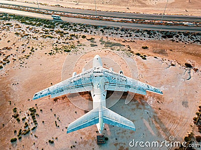 Deserted airplane in the in the Umm Al Quwain desert in the emirate of the United Arab Emirates Stock Photo
