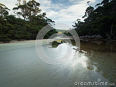 Deserted island river inlet, windless morning Stock Photo