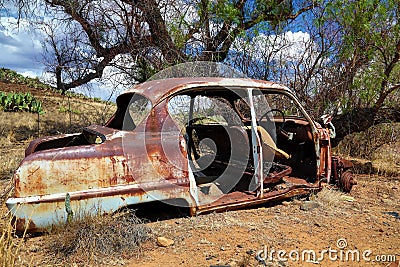 Deserted and Rusted Auto Wreck Stock Photo