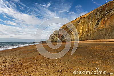 Sunlight lights the copper cliffs at Whale Chine in The isle of wight, England Stock Photo