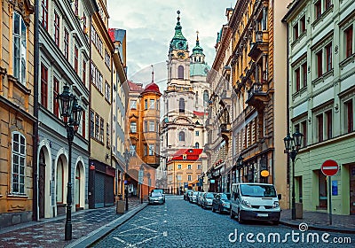 Deserted street with old house and view on tower from cathedral in prague Stock Photo