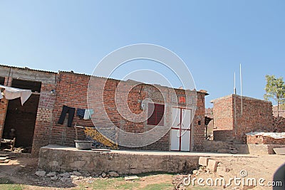 Design of a basic red brick home in India Stock Photo