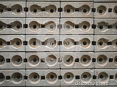 Design circle hole concrete block wall background Stock Photo