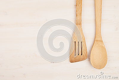 Design concept of mockup of empty wood beige spoons on white wood background. Stock Photo