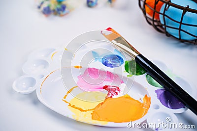Design concept - Preparing for Easter celebration, painting Easter eggs with colorful Acrylic pigment color dyestuff in palette, Stock Photo