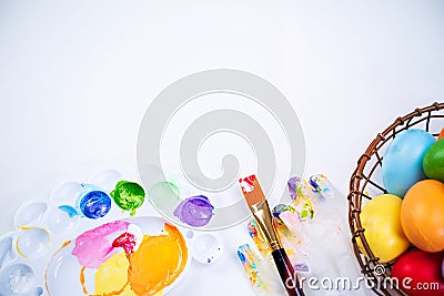 Design concept - Preparing for Easter celebration, painting Easter eggs with colorful Acrylic pigment color dyestuff in palette, Stock Photo