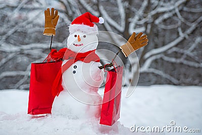 Design Gift Handmade. Greeting snowman. Delivery gifts. Holiday poster design. Happy snowman with Christmas gift Stock Photo