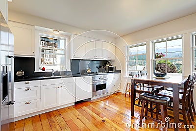 Design of kitchen room interior with white cabinets and black counter tops Stock Photo
