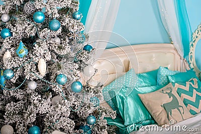 Christmas tree with presents underneath in living room Stock Photo