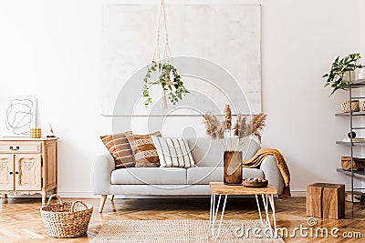Sunny living room with boho accessories. Stock Photo