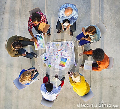 Design Team Planning on a Project with Color Swatches Stock Photo