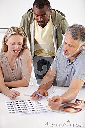 Design, teamwork and people planning with magazine, photoshoot and review of photography editing process. Creative Stock Photo