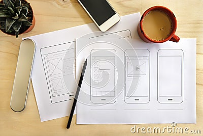 Designer desk with mobile application wireframe Stock Photo