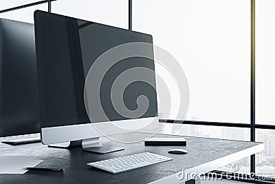 Designer desktop with blank black computer screen Editorial Stock Photo