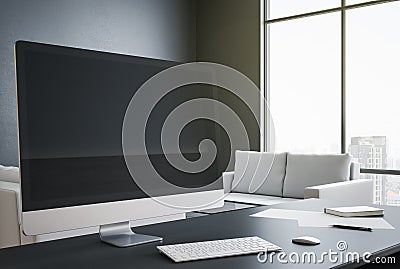 Designer desktop with blank black computer screen Editorial Stock Photo