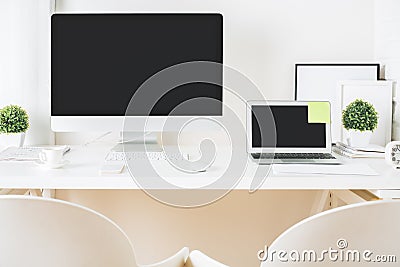 Designer desktop with computer and notebook front Stock Photo