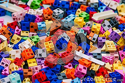 Designer details are colored. Small square blocks of a board game. Development of imagination and logic in a child in kindergarten Stock Photo