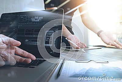 Designer hand working with digital tablet computer and smart phone on wooden desk as responsive web design concept Stock Photo