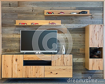 Designer living room wall with tv wooden cupboard Stock Photo