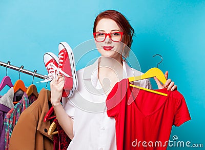 Designer with red dress and gumshoes Stock Photo