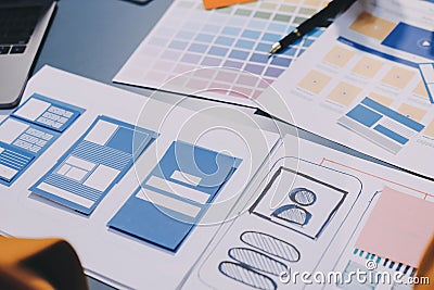 The designer team is designing the uxui system to make the uxui system work well on new phones and support system updates. Website Stock Photo